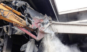 A mechanical pulveriser from Jet Demolition used to crush concrete on-site, which is one of their demolition robots.ite
