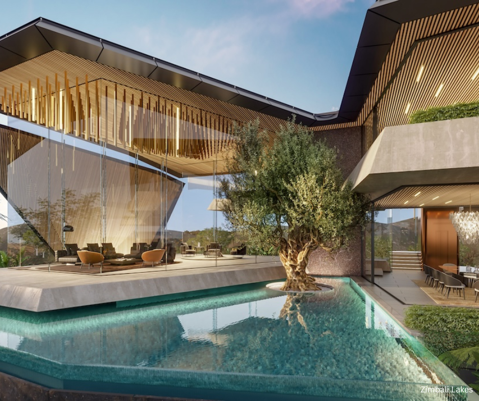 Modern luxury home with glass walls overlooking a reflective pool and central tree.