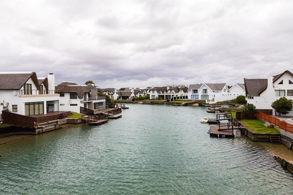 Waterfront homes with private docks along a canal.