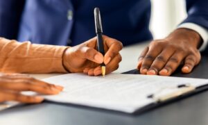 Applicant completing a Z83 job application form for Department of Public Works and Infrastructure vacancies